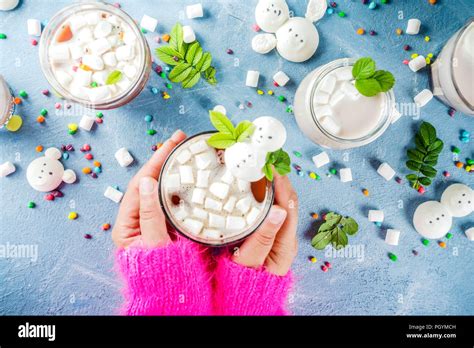 Girl Drinks Hot Chocolate With Funny Marshmallow In Form Snowmen White Bears With Sweets And