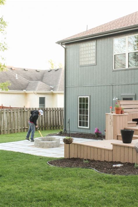 Diy Patio With Grass Between Pavers And A Fire Pit Diy Backyard