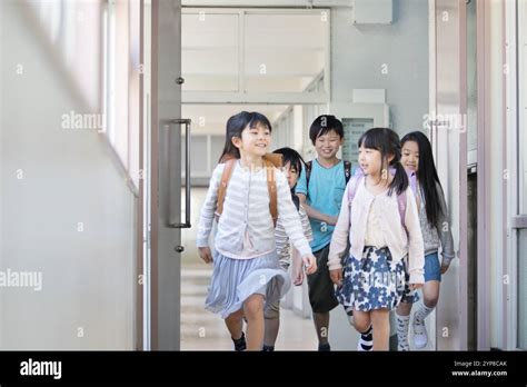 Primary School Children Carrying School Backpacks Stock Photo Alamy