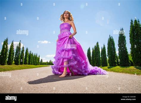 Blonde Woman In Beautiful Pink Dress On Alley Stock Photo Alamy