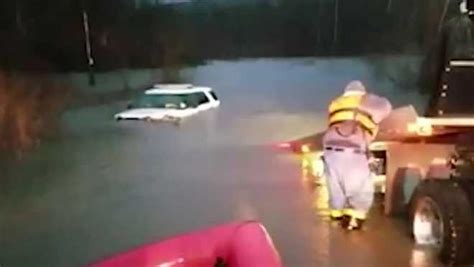 Police Officer Rescued From Car Stuck In Rising Floodwaters In