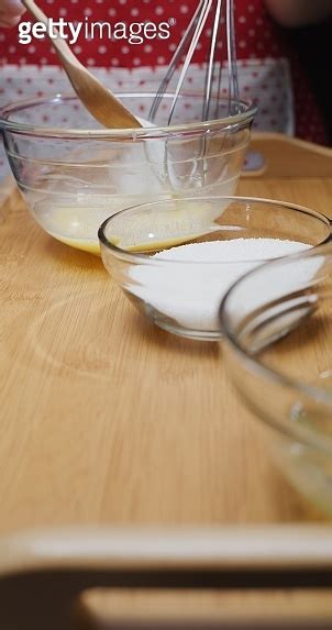 Making French Crepe Batter At Home Adding Sugar Close Up Vertical