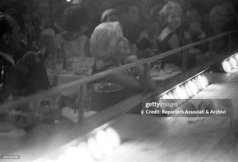 American Actress Marilyn Monroe Listening To Actor And Singer Frank