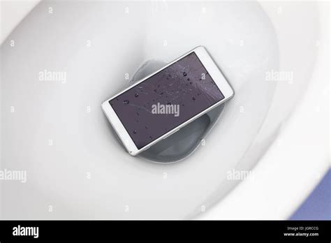 Broken Mobile Phone Dropped Into Toilet Bowl Stock Photo Alamy