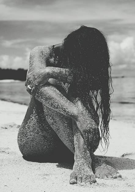 Premium Photo Naked Messy Woman Sitting At Beach