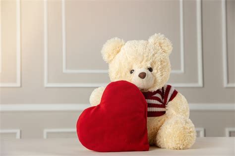 Premium Photo | Valentine's day, Cute Stuffed bear holding heart,