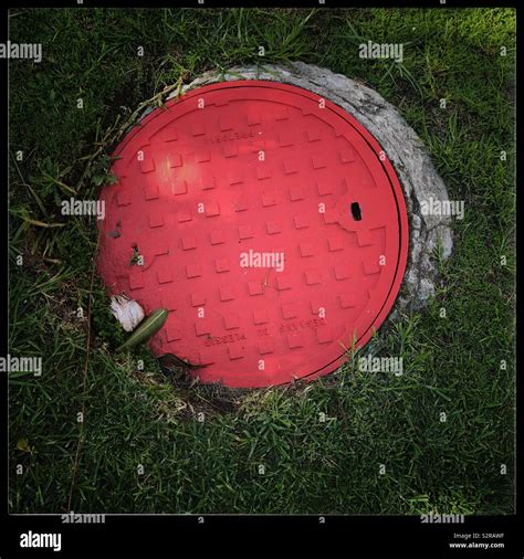 Red drain cover Stock Photo - Alamy