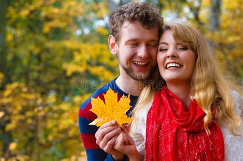 Couple Playing With Leaf In Autumn Park Stock Photo Image Of Sunlight