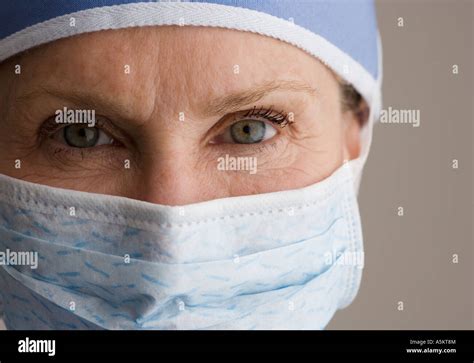 Close Up Of Female Doctor Wearing Surgical Mask Stock Photo Alamy