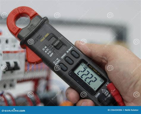 Voltage Measurement Using A Multimeter In An Electrical Panel. Stock ...