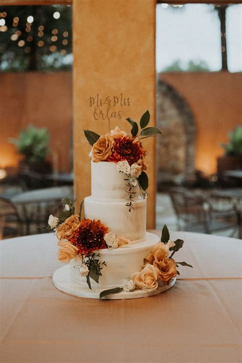 Stunning Naked Wedding Cake With Fall Flowers Burnt Orange Red And