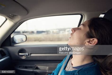 A Woman Sleeps In The Front Passenger Seat Of A Car While Traveling Sleep In Car Sleep Women