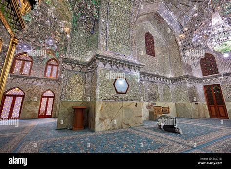 A Man Prays In The Ali Ibn Hamzeh Holy Shrine Elaborately Decorated