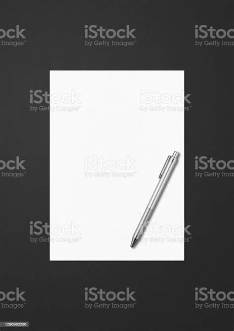 Blank White A4 Paper Sheet And Pen Mockup Template On Black Background