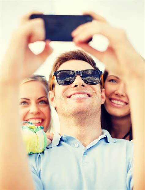 Couple Of Young Women Best Friends Taking A Selfie During Sunset Stock