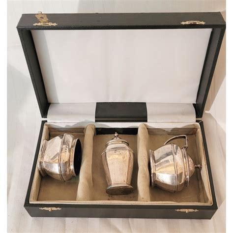 A CASED SET OF SCOTTISH SILVER CONDIMENT PIECES Date Letter F For