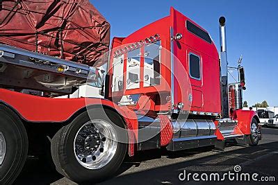 Bright Red Big Rig Classic American Semi Truck With Flat Bed Semi