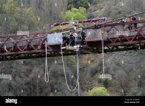 Man about to bungee jump from the Hackett Kawarau Bridge in New Zealand ...