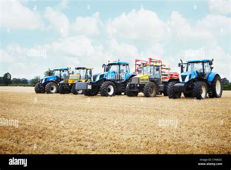 Tractors Parked In Tilled Crop Field Stock Photo Alamy