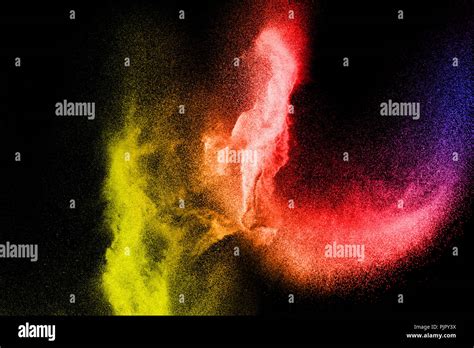 Freeze Motion Of Color Dust Particles On Black Background Abstract