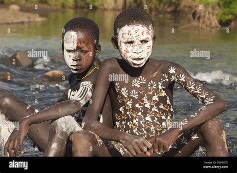 Surma boys with body painting, face painting, in river, Surma tribe ...