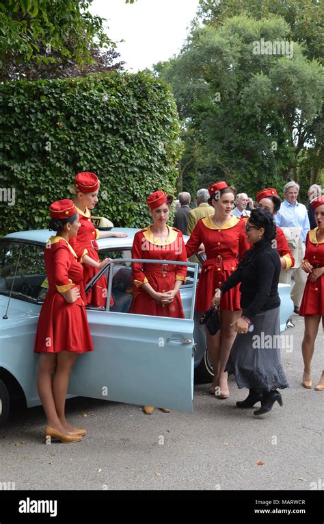 Girls In Taxi Cab Uniforms Taking Part In The 2014 Goodwood Revival Event Held Each Year At The