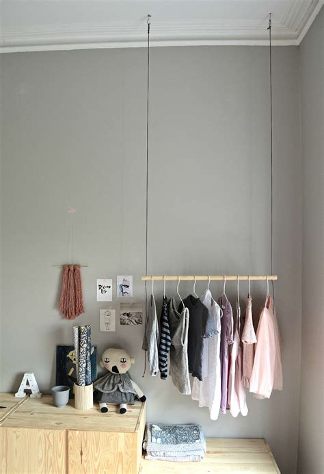 Hang On With This Diy Hanging Clothes Rack Diy Home Decor Your Diy