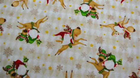 An Image Of Christmas Fabric With Reindeers And Snowflakes On It S