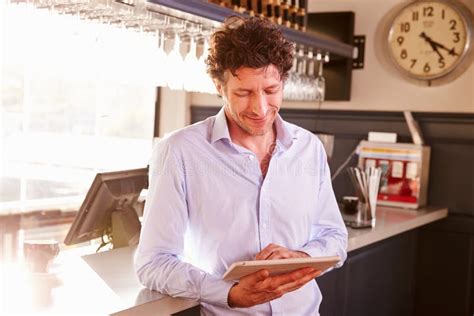 Male Restaurant Owner Owner Using Digital Tablet Stock Image Image Of