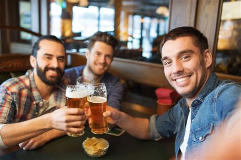 Friends Taking Selfie And Drinking Beer At Bar Cazalys