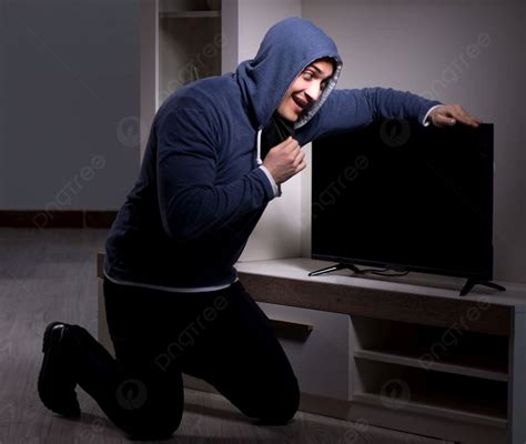 The Burglar Thief Stealing Tv From Apartment House Burglar Thief