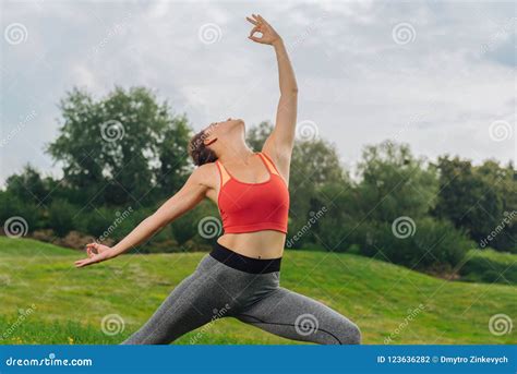 Slim Graceful Woman Feeling Amazing While Doing Yoga Poses Stock Photo