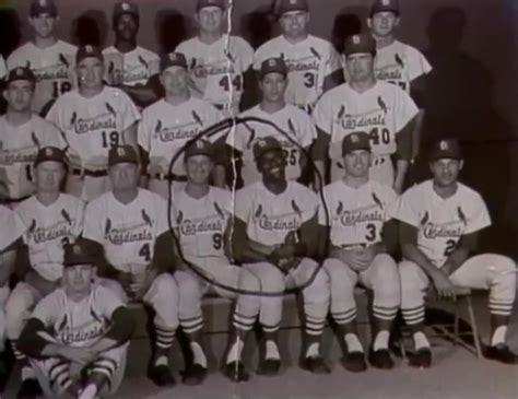 Bob Uecker holding hands with Bob Gibson. 1964. : Brewers