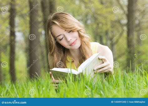 Girl Reading Book On Grass Stock Image Image Of Hand 143491343