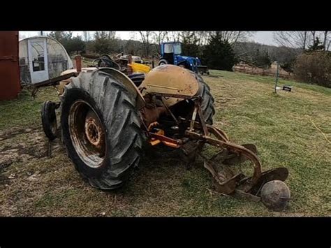 N Ford Tractor Plowing Carrots In Snow Wind Snow Squall Using A