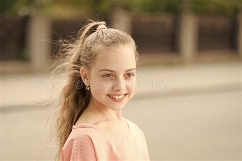 Child Cosmetics Cute Little Girl Looking In The Mirror Stock Photo