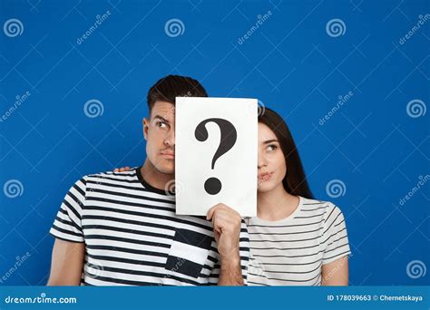 Couple Holding Question Mark Sign On Background Stock Image Image Of Mark Interrogation