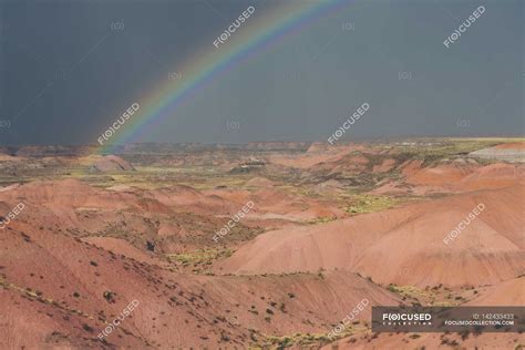 Rainbow and storm clouds — beauty in nature, Non Urban Scene - Stock Photo | #142433433