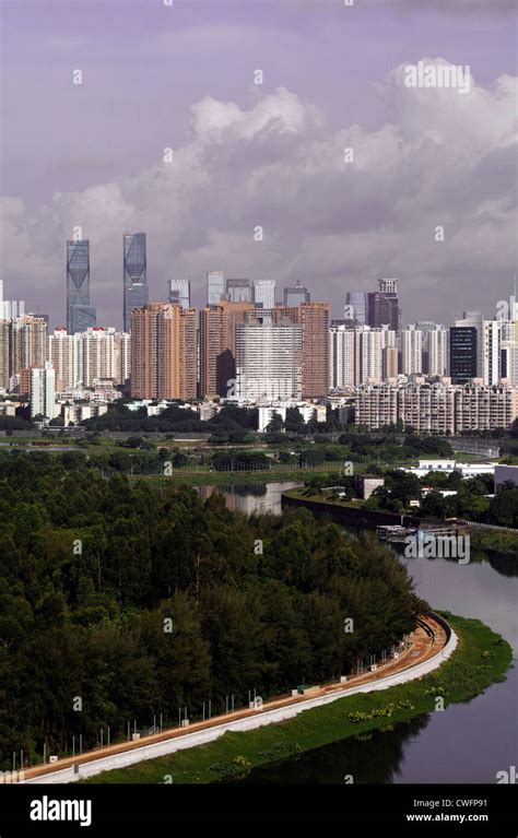 Storm clouds gathering over Shenzhen/Hong Kong border wall. China Stock ...