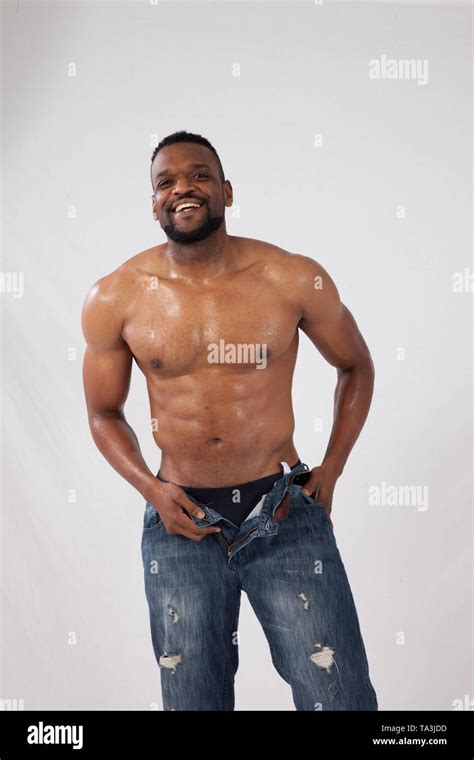 Happy strong Black Man with his shirt off Stock Photo - Alamy