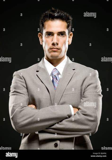 Businessman With Arms Folded Stock Photo Alamy