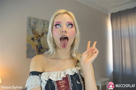 Pretty Blonde Vasya Sylvia Has Her Thong Pulled Down With Her Tongue Stuck Out CoedCherry