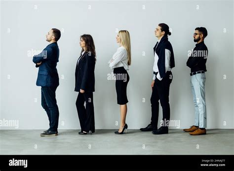 Long Line Of Diverse Professional Business People Standing In A Queue