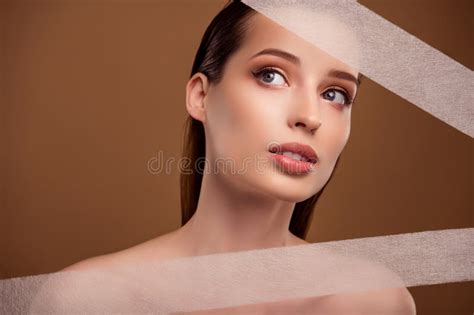 Photo Of Dreamy Adorable Lady Naked Shoulders Applying Body Lifting Stripes Isolated Brown Color