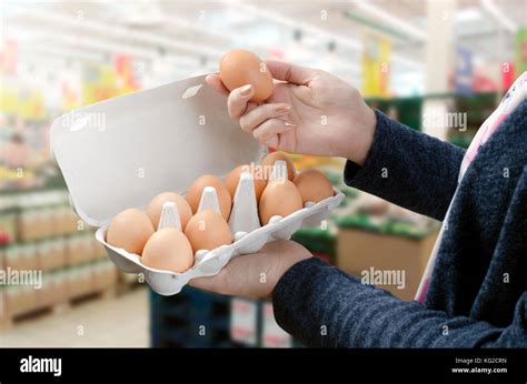 Woman Buys Eggs In The Supermarket Egg Store Supermarket Price