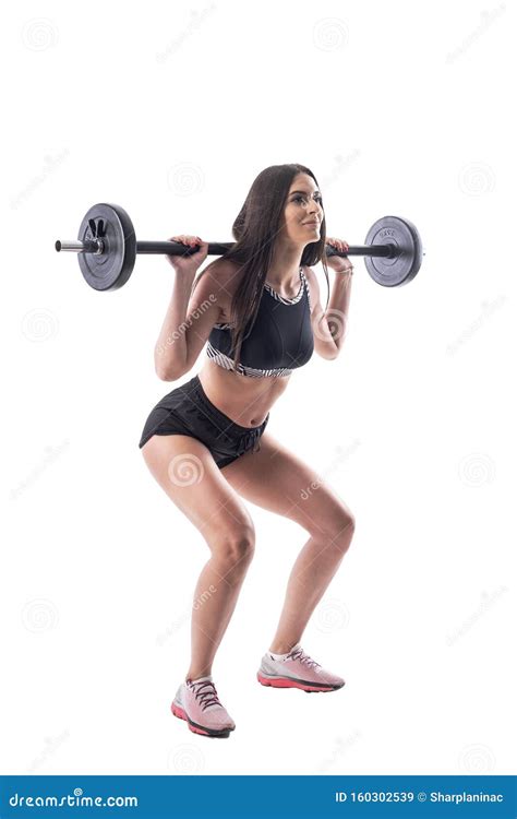 Side View Of Attractive Athletic Gym Woman Doing Squat Exercises With Barbell Stock Image