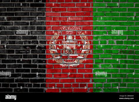 National Flag Of Afghanistan Depicting In Paint Colors On An Old Brick