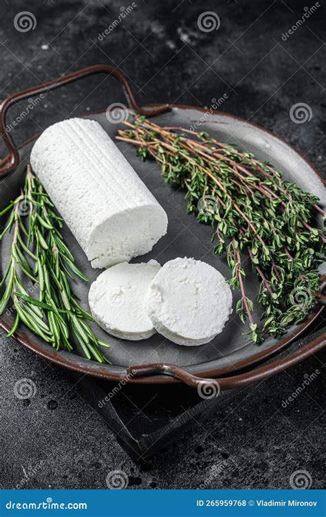 Chevre Goat Soft Cheese With Herbs On A Tray Black Background Stock