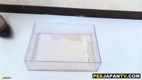 Asian Babe Pisses Golden Shower