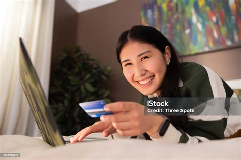 Photo Of Delighted Asian Kazachstan Girl In Casual Clothes Outfit Smiling At Camera While Laying